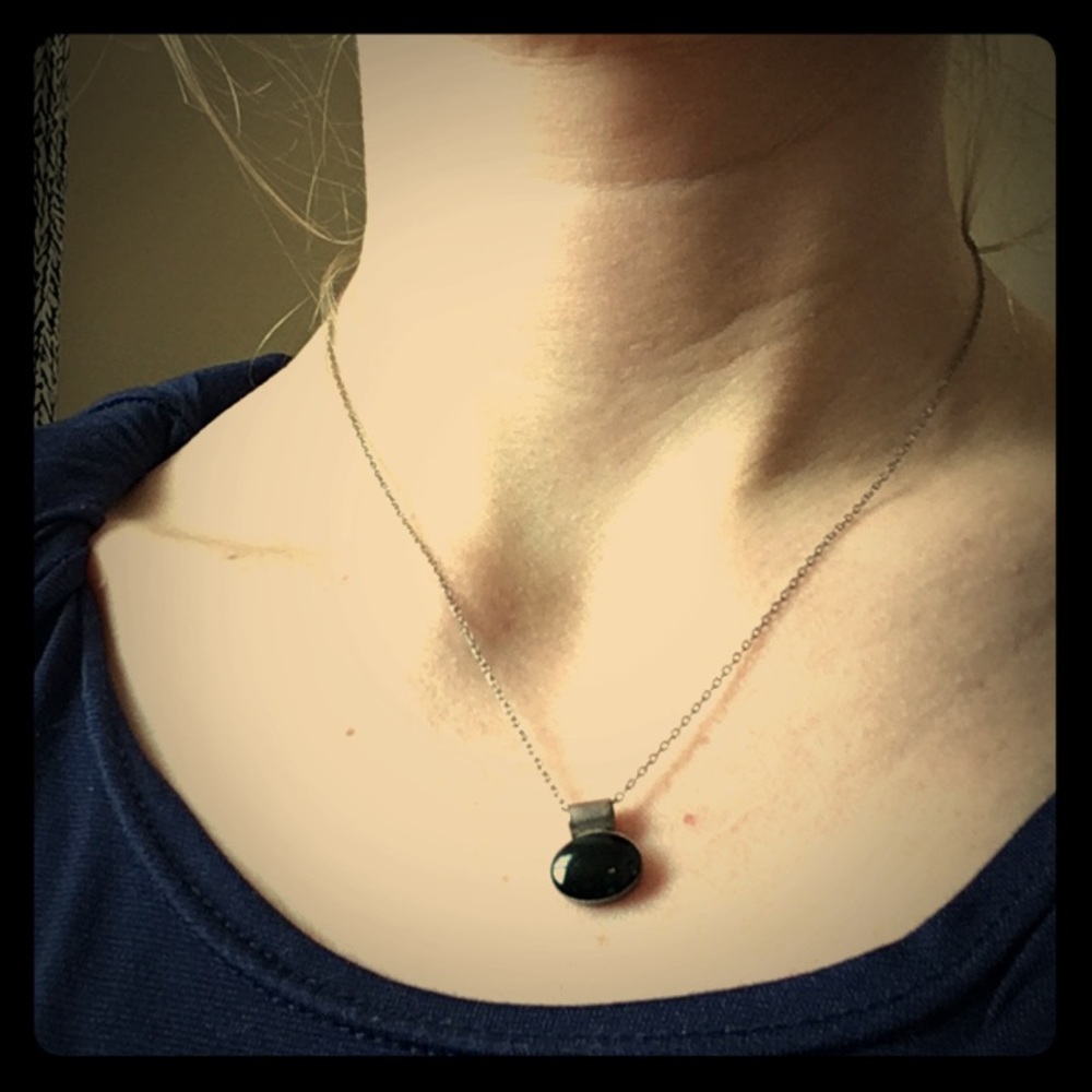 Necklace with black stone.